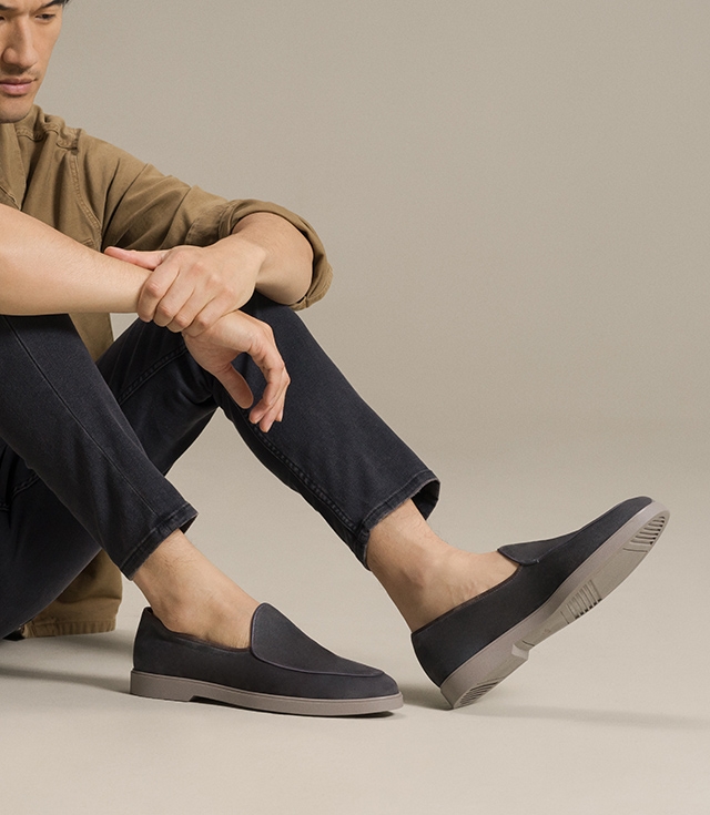 Male model styled in tan shacket and dark gray pants wearing the Danil dress shoe.