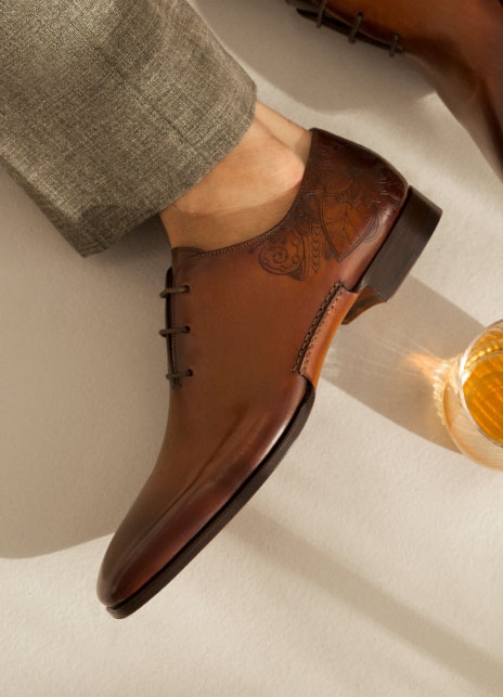 Close up of the Magnanni Samos dress lace up shoe on a male model's foot.