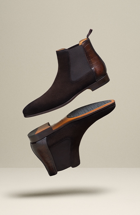 Magnanni Renley dress boots float in mid-air.