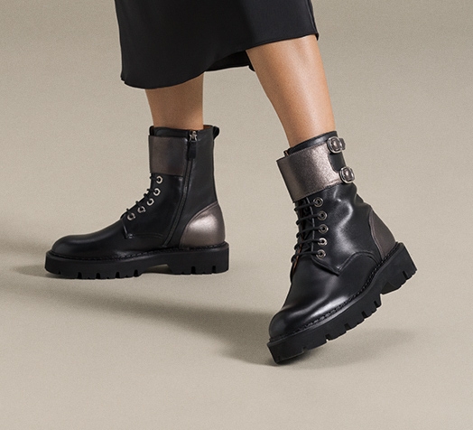 A female model wears all new Magnanni platform boots for women.